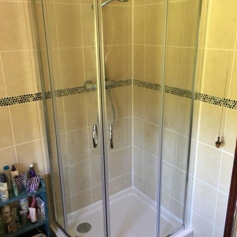 Shower cubicle and tray fitting